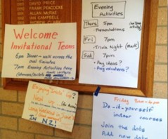 Collage of colorful sticky notes on a corkboard with a welcome message and reminders about upcoming activities and events.
